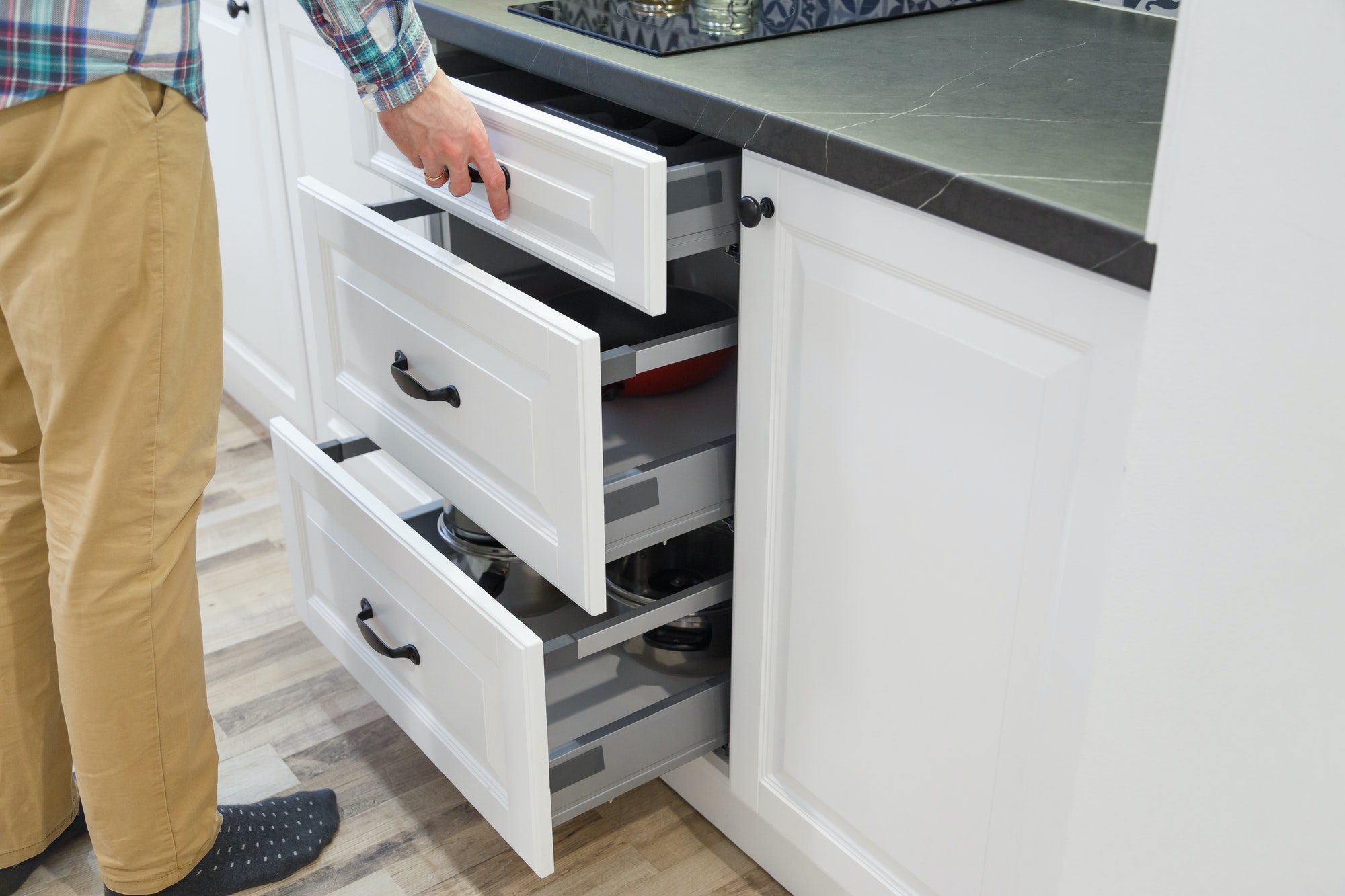 drawer in front of kitchen sink